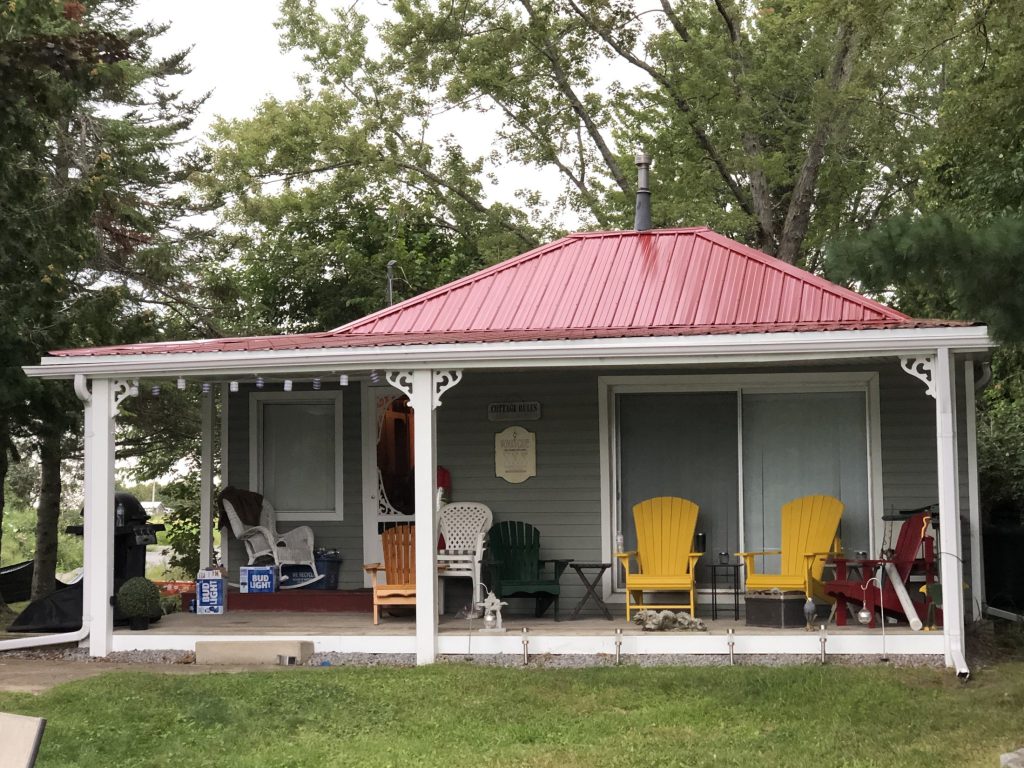 Cottage with barn-steel roof after repair