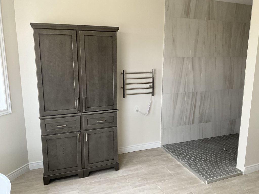 Tiled shower area in the renovated bathroom