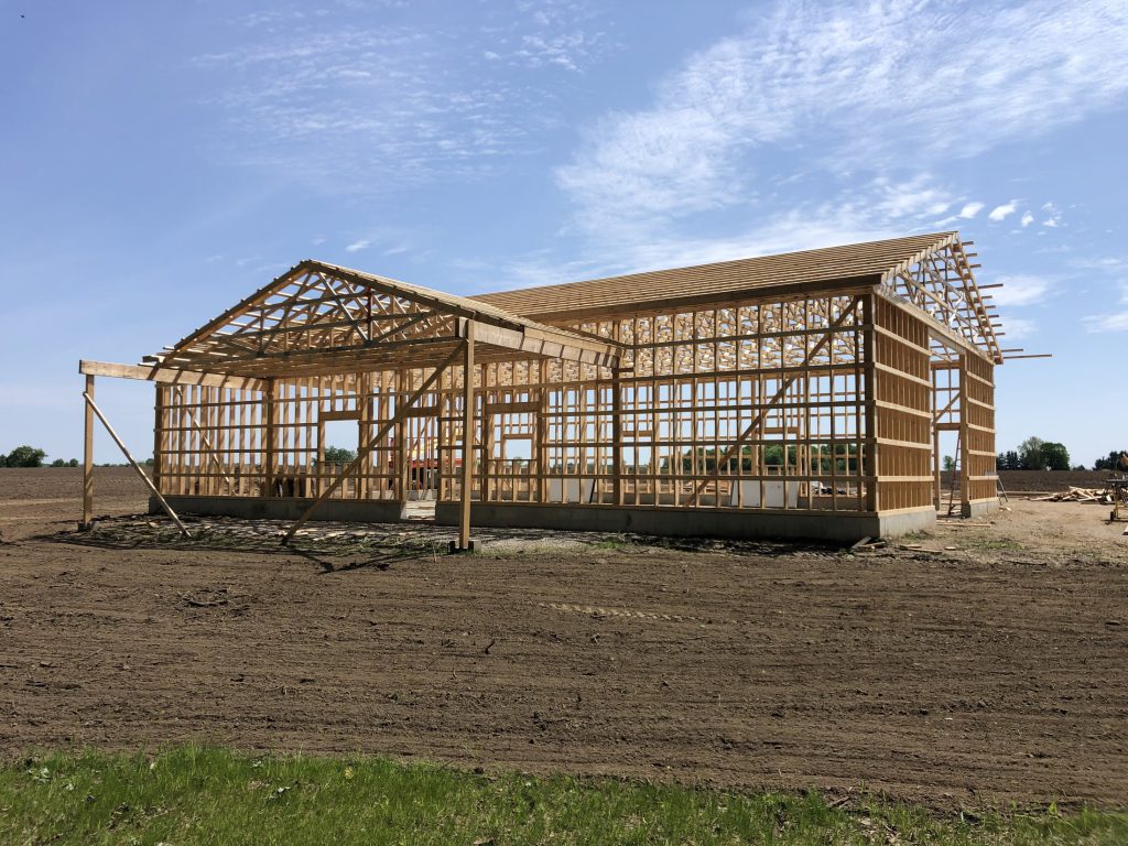Completed residential shop with a covered entry