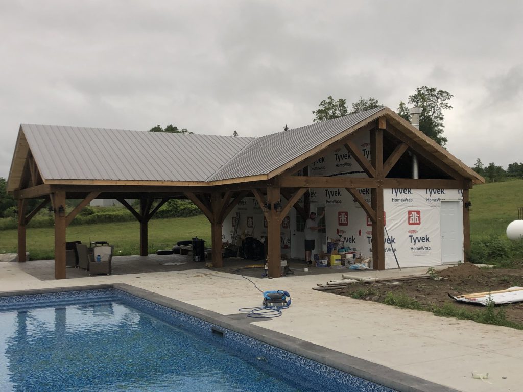 Pool house beside a residential swimming pool