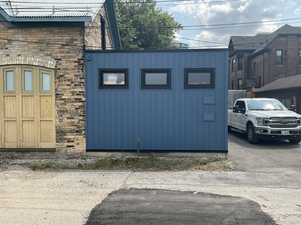 Front elevation of blue exterior siding project