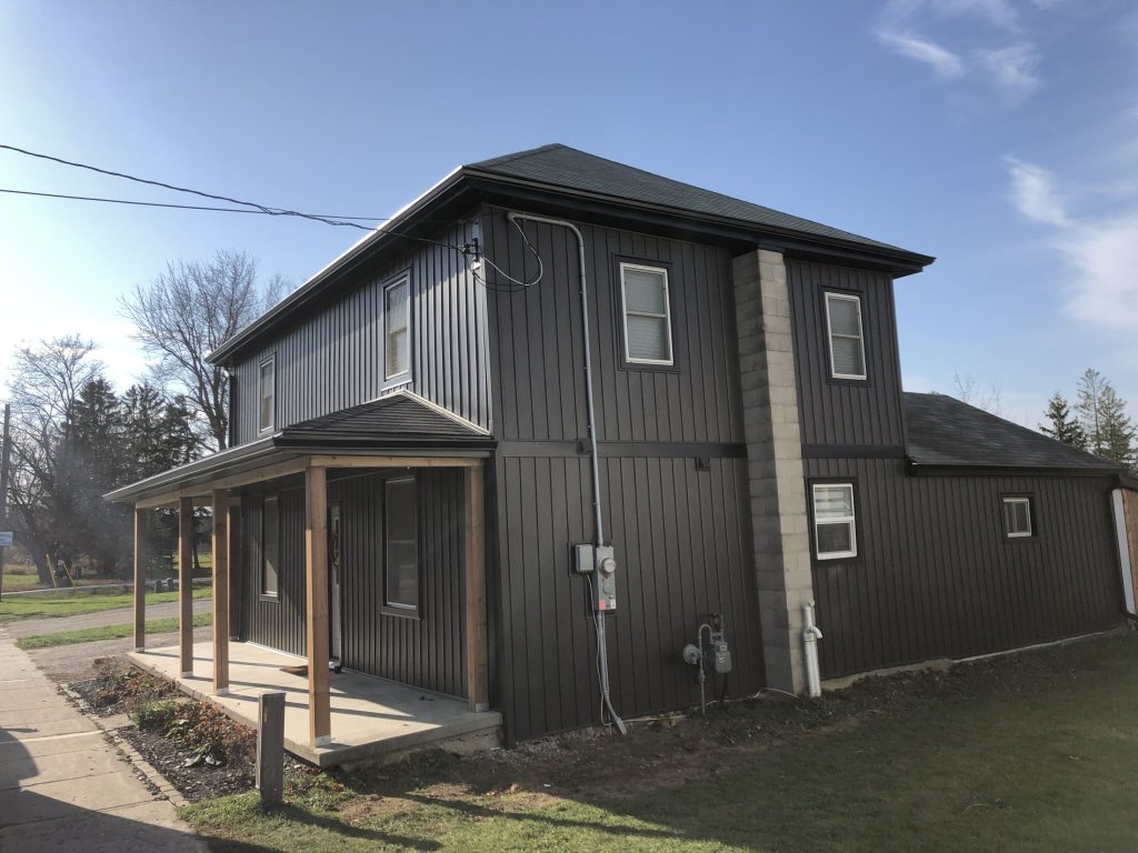 Completed residential shop with covered entry