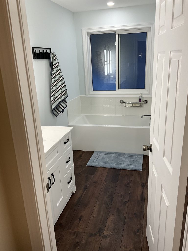 Renovated bathroom vanity and flooring in Paris