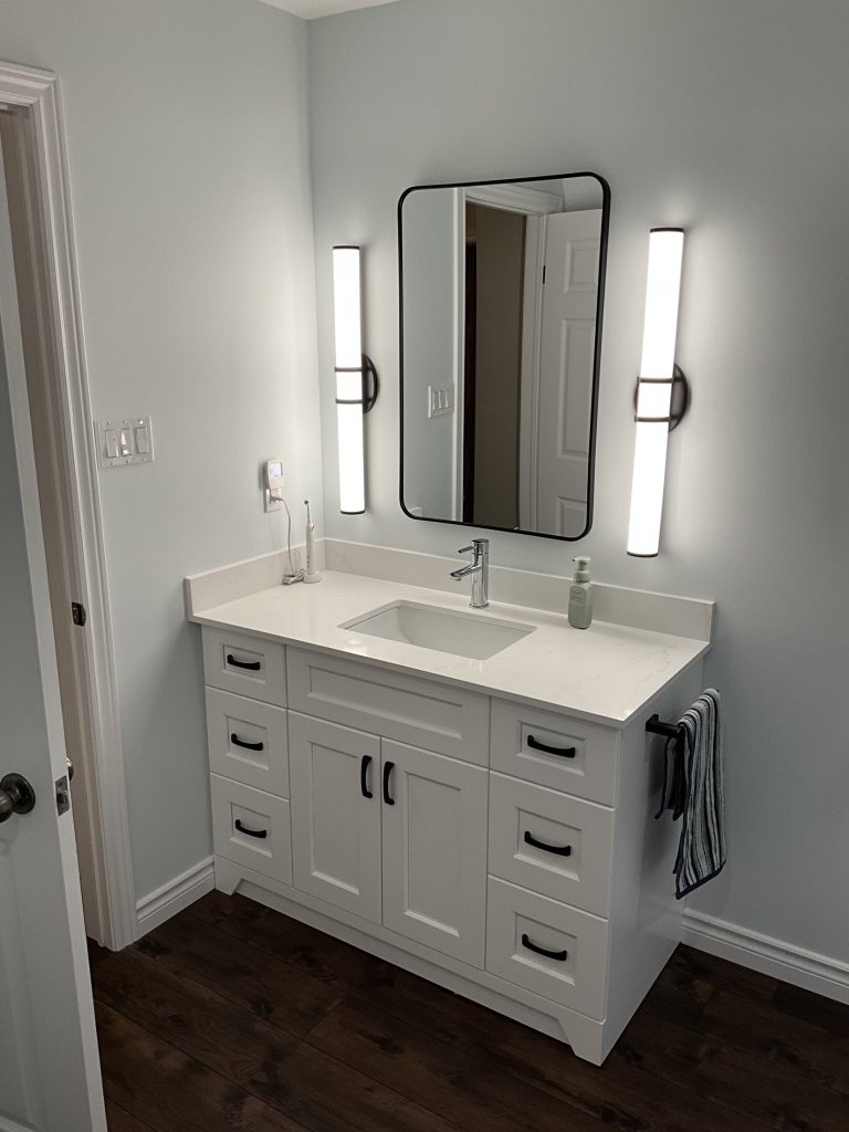 New vanity and mirror in the renovated bathroom