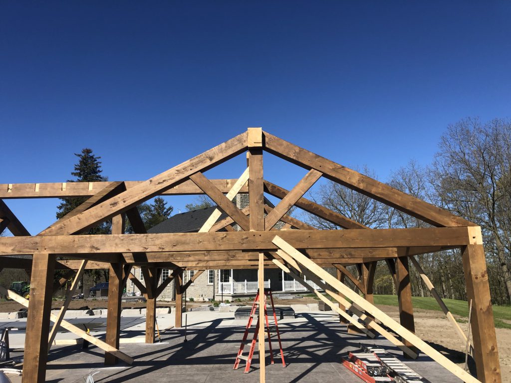 Timber framing of the pool house in progress