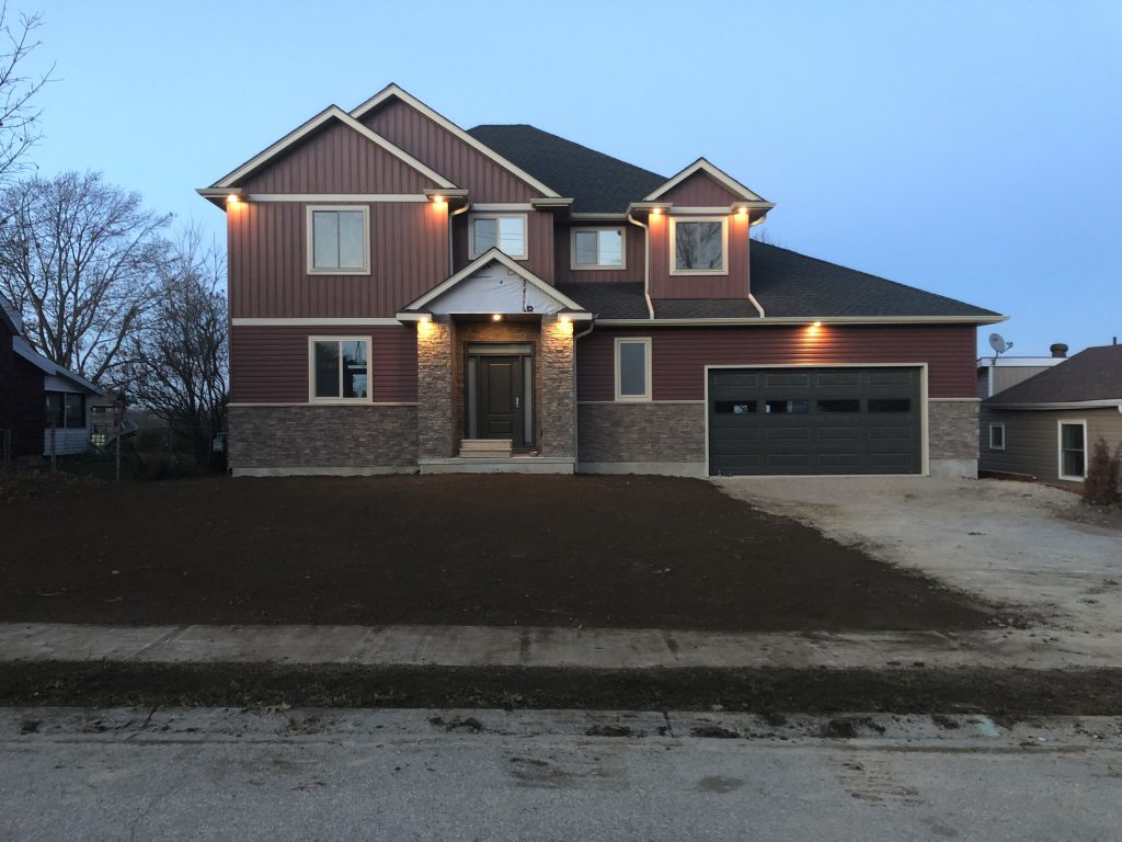New Drumbo home exterior at dusk